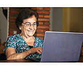   Senior, Smiling, Typing, Online